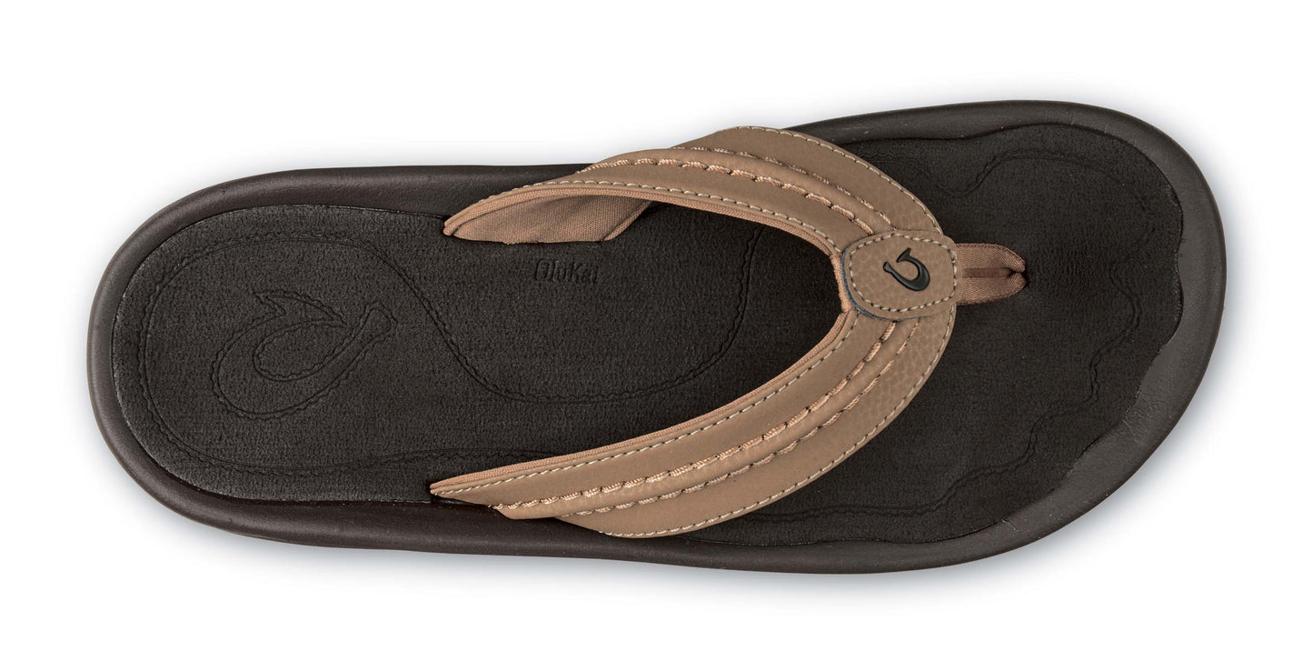 Top-down view of brown sandal with toe strap.