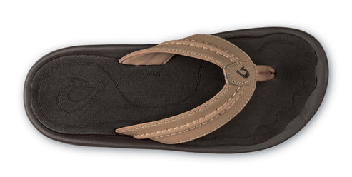 Top-down view of brown sandal with toe strap.