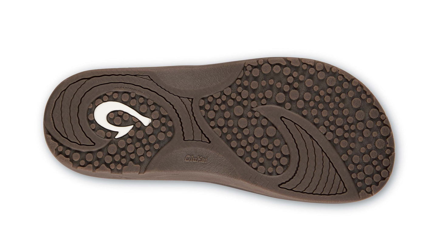 Sole of brown sandal with white hook-shaped design.
