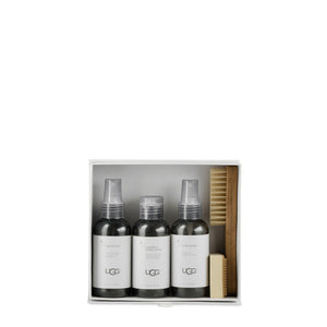 Cleaning kit containing three small spray bottles, brush and small sponge; items packaged in a white box.