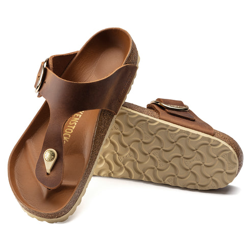 Pair of brown leather sandal with toe post and adjustable buckle.