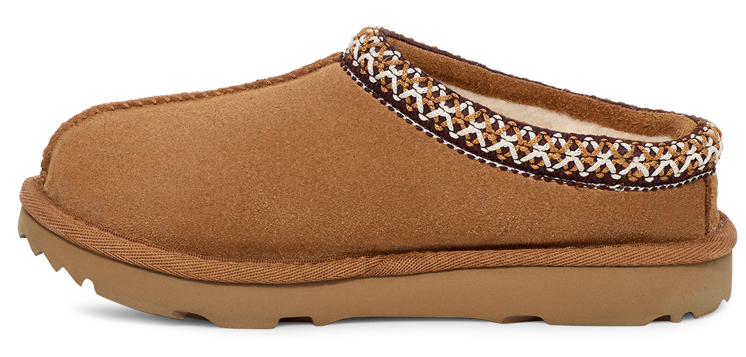 A brown suede slipper with a patterned trim.
