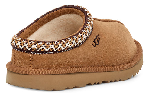 Tan-colored UGG slipper with brown and white woven trim.