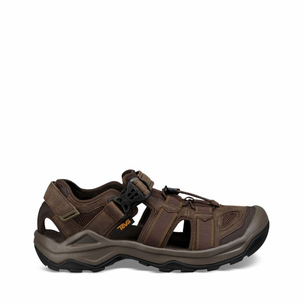 Brown sandal with toe protection, adjustable straps, and thick sole.