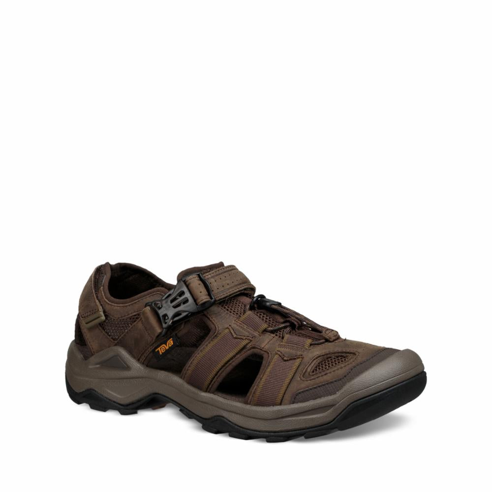 A brown sandal with a velcro strap.