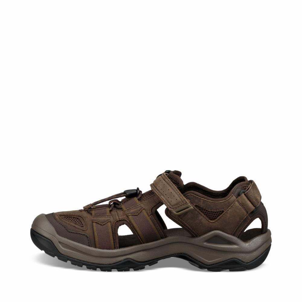 Brown leather hiking sandal with velcro strap.