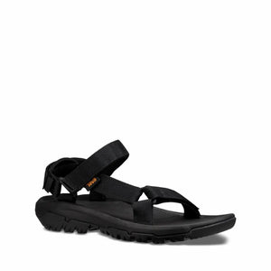 Black sandal with adjustable straps and a textured sole.