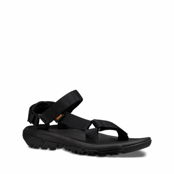 Black sandal with adjustable straps and a textured sole.