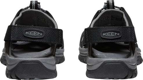 A pair of sandals with black straps and gray soles, showing the back view with KEEN logo on the strap.