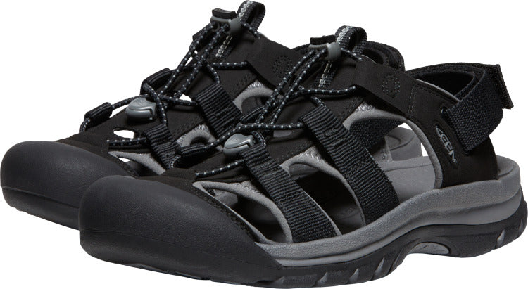 A pair of black water sandals with gray accents, closed toe, adjustable straps and bungee cord lacing.