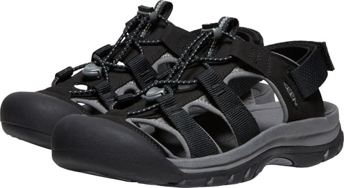 A pair of black water sandals with gray accents, closed toe, adjustable straps and bungee cord lacing.