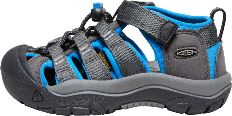 Low-profile child's water sandal in gray and blue, featuring a closed-toe design with elastic cording and velcro strap; KEEN logo visible on the side.