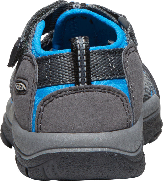 A grey and blue sandal featuring a heel strap and adjustable velcro.