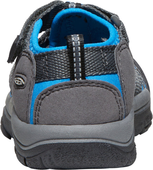 A grey and blue sandal featuring a heel strap and adjustable velcro.