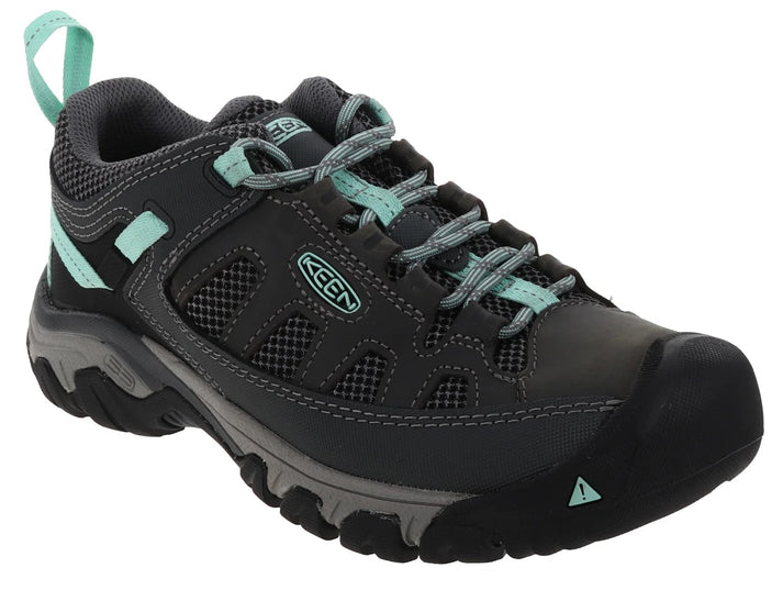 A gray and teal walking shoe with a black toe cap.