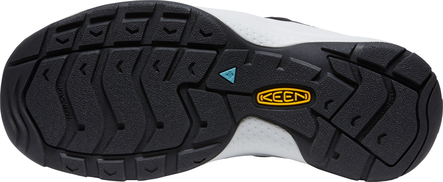 A shoe sole with a black tread pattern and a yellow logo that says KEEN.