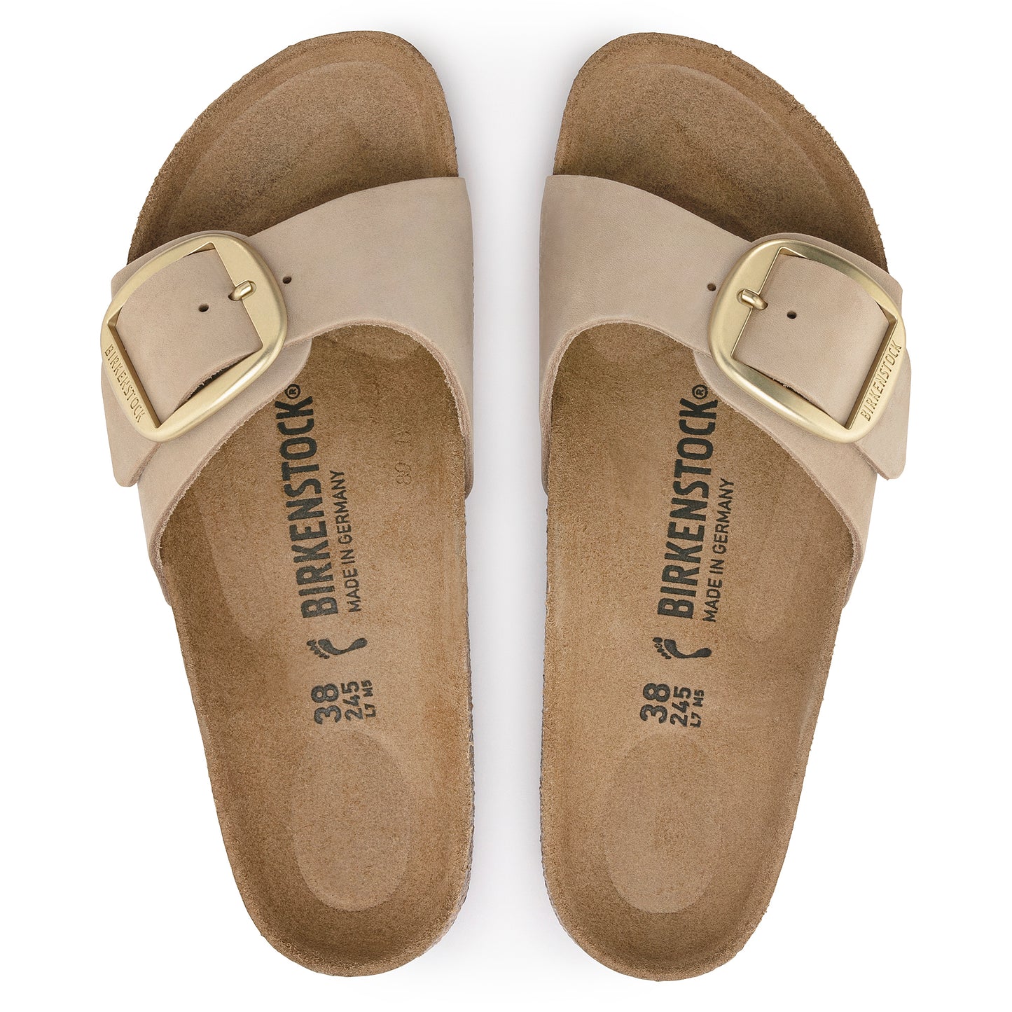 Pair of beige slide sandals with gold buckles, "BIRKENSTOCK" printed inside.