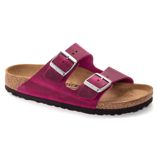 Magenta two-strap sandal with silver buckles and a cork footbed.