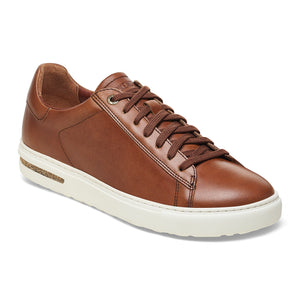 Brown leather sneaker with laces and white sole.