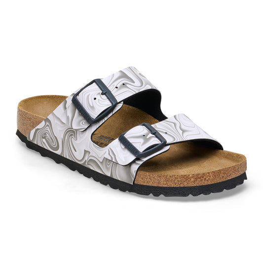 A sandal with marble patterned straps and two black buckles.