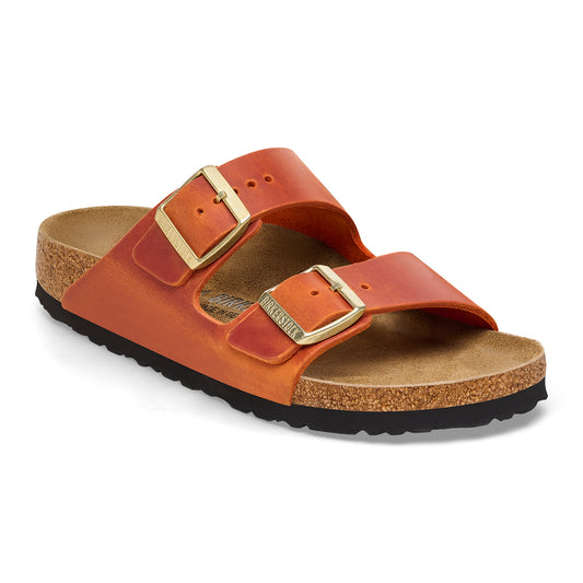 Orange sandal with two adjustable straps and gold buckles.