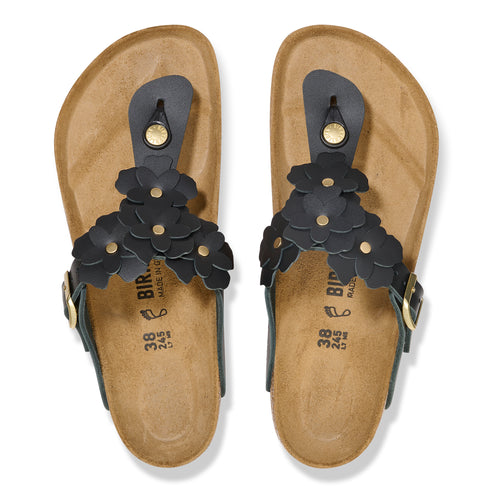 Pair of black flip-flops with black leather floral accents.