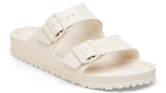 Off-white, two-strap adjustable slide sandal with buckle hardware.