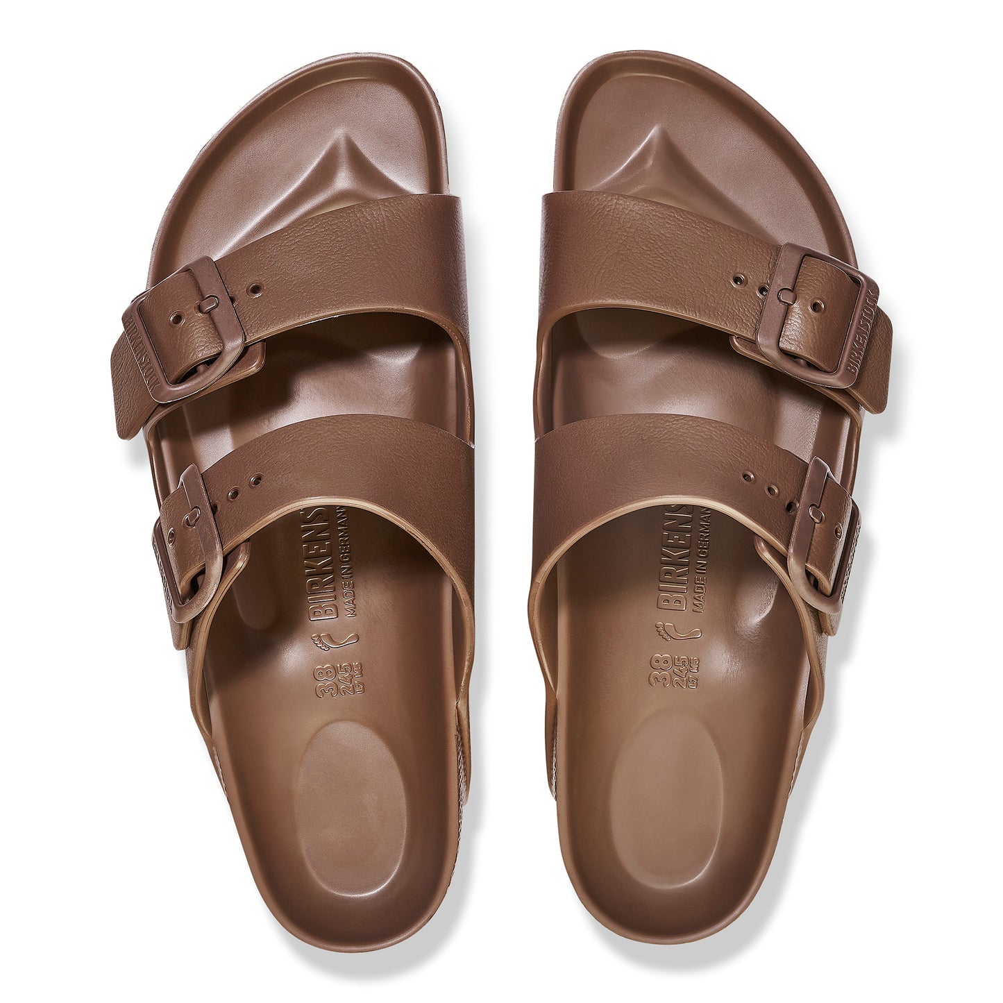 Top-down view of brown two-strap sandals with buckles.