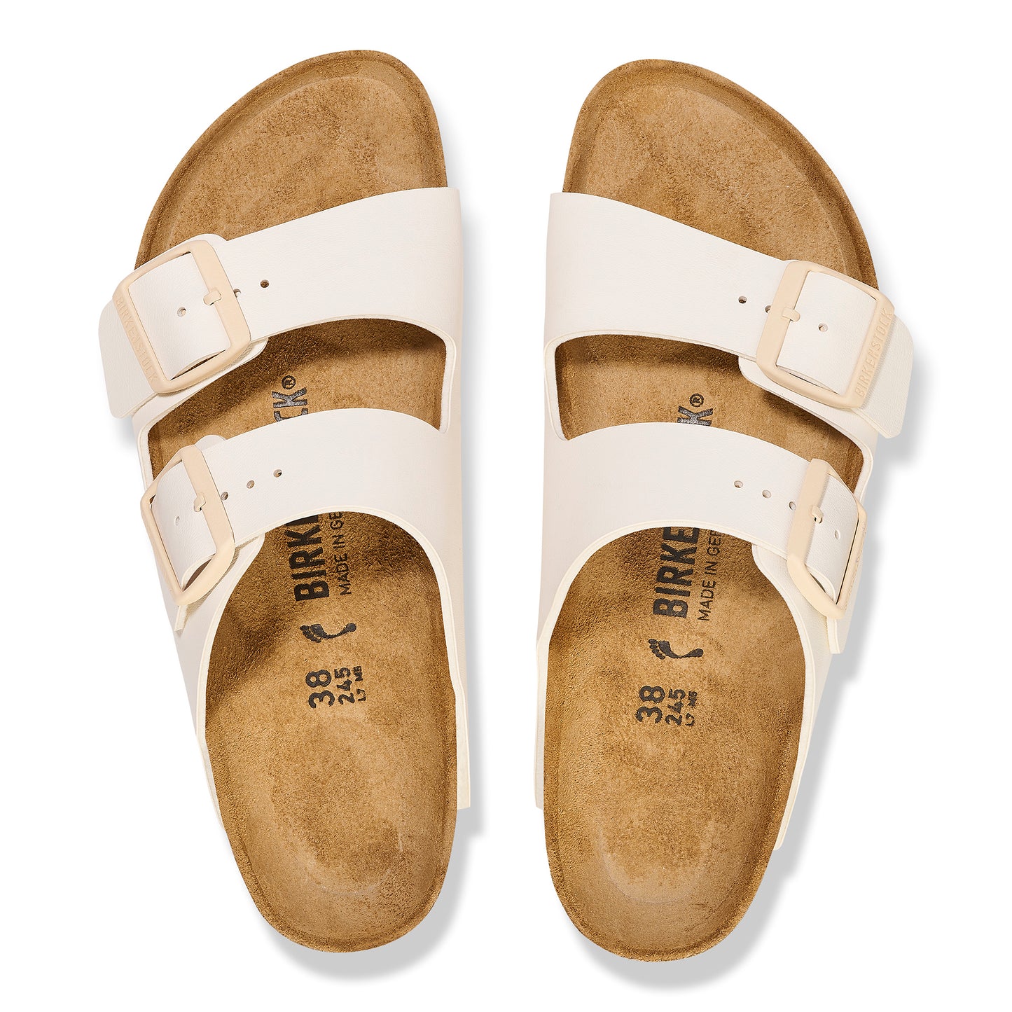 Pair of white, two-strap sandal-style shoes with buckle closure; "BIRKENSTOCK, MADE IN GERMANY, 38 245" printed on the insole.