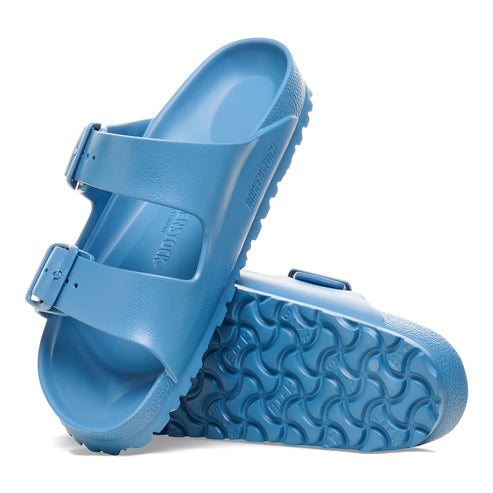 Blue two-strap sandals with adjustable buckle closures and patterned soles.