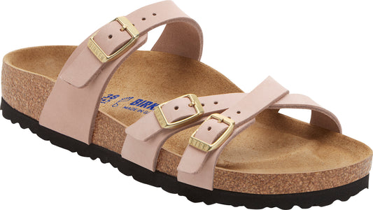 Pale pink sandal with three adjustable straps, cork footbed, and black sole.