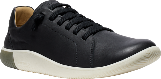 A black leather sneaker with black laces and a white sole.