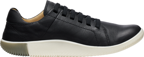 A black leather sneaker with white sole and black laces.