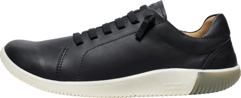 A black leather sneaker with a white sole and black laces.