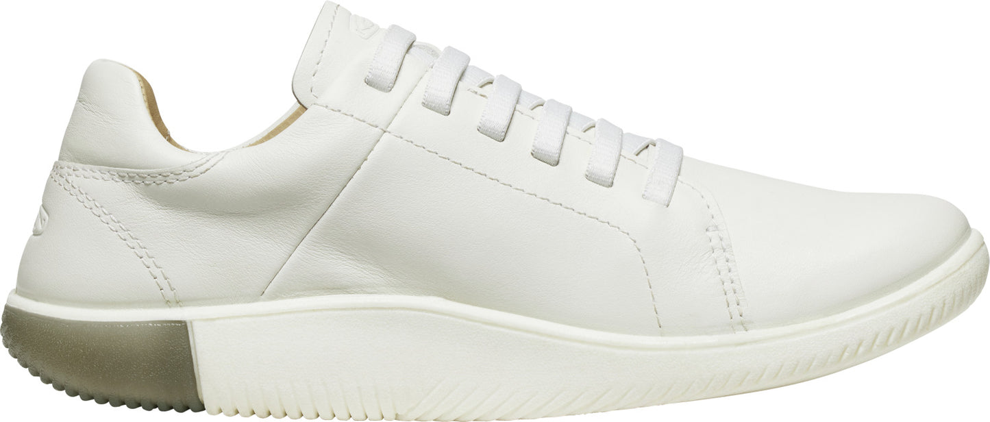 A white leather sneaker with a contrasting sole.