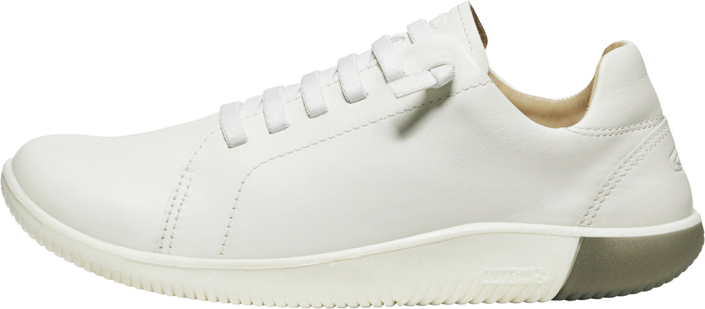 A white leather sneaker with matching sole and laces.