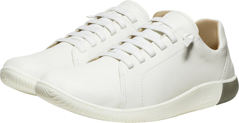 Pair of white, low-top sneakers with laces.