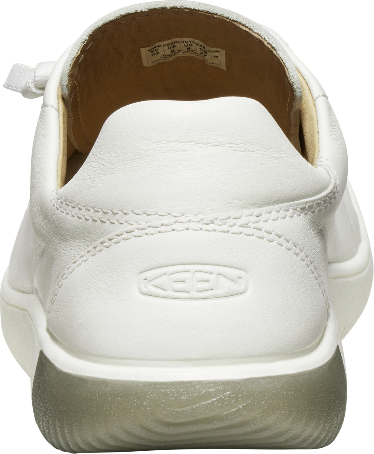 Back view of an all-white leather sneaker with the word "KEEN" embossed on the heel.