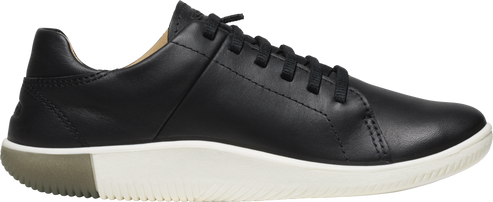 A black leather sneaker with white soles and black laces.