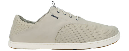 A shoe with a perforated pattern.