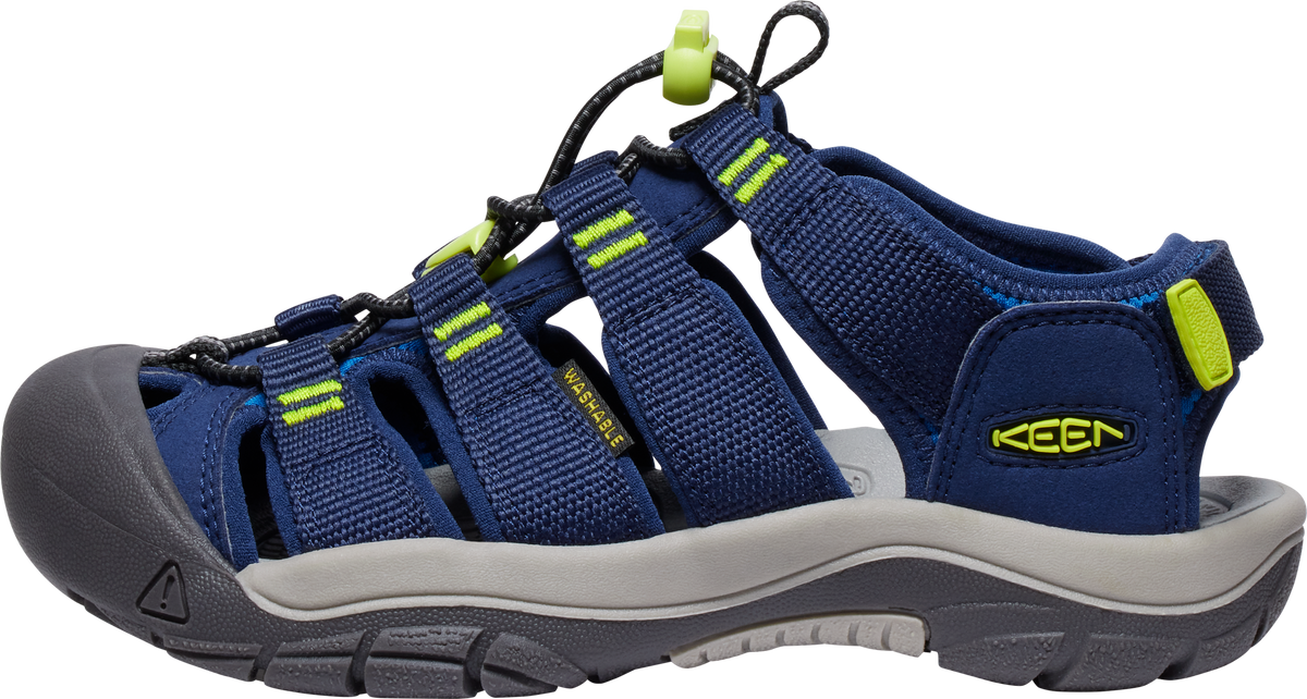 Navy blue sandal with a gray sole and neon green accents.
