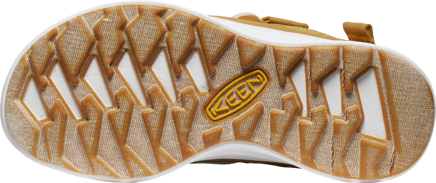 Tan shoe outsole with white recesses and 'KEEN' brand label.