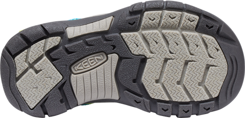 The sole of a shoe has a black exterior with gray treads.