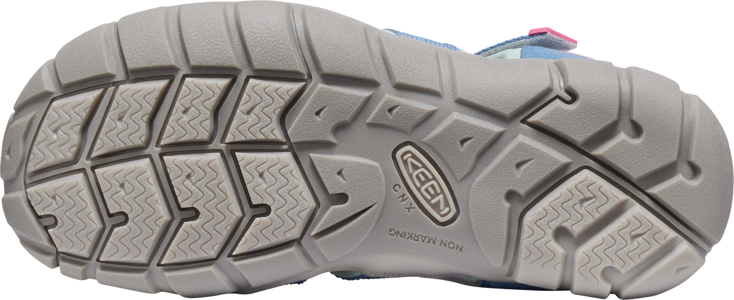 Bottom of a sandal with a gray sole, featuring a pattern of rectangular treads.