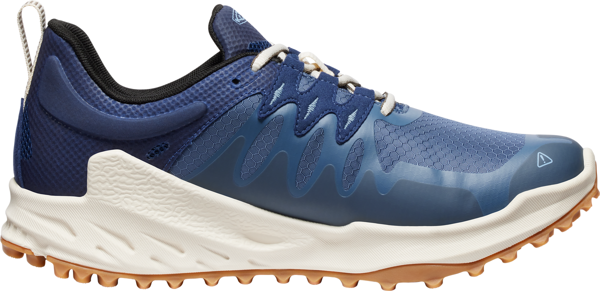 A navy blue athletic shoe with a light tan sole.