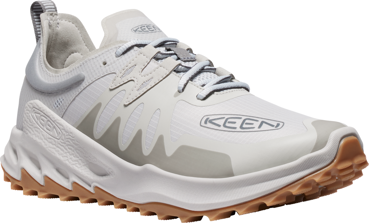 A white running shoe with brown lug sole and gray accents. The side displays the brand KEEN.