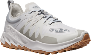 A white running shoe with brown lug sole and gray accents. The side displays the brand KEEN.