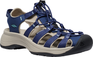Blue sandal with criss-cross elastic cord laces, toe protection, and the word "WATERPROOF" printed on its side.