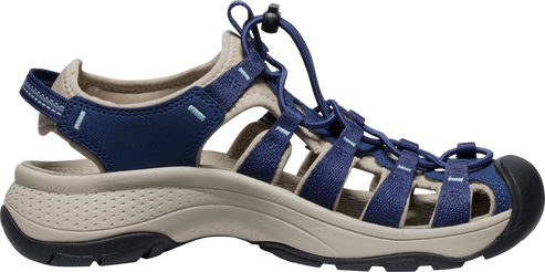 A blue and tan hiking sandal with bungee laces and a black toe cap.
