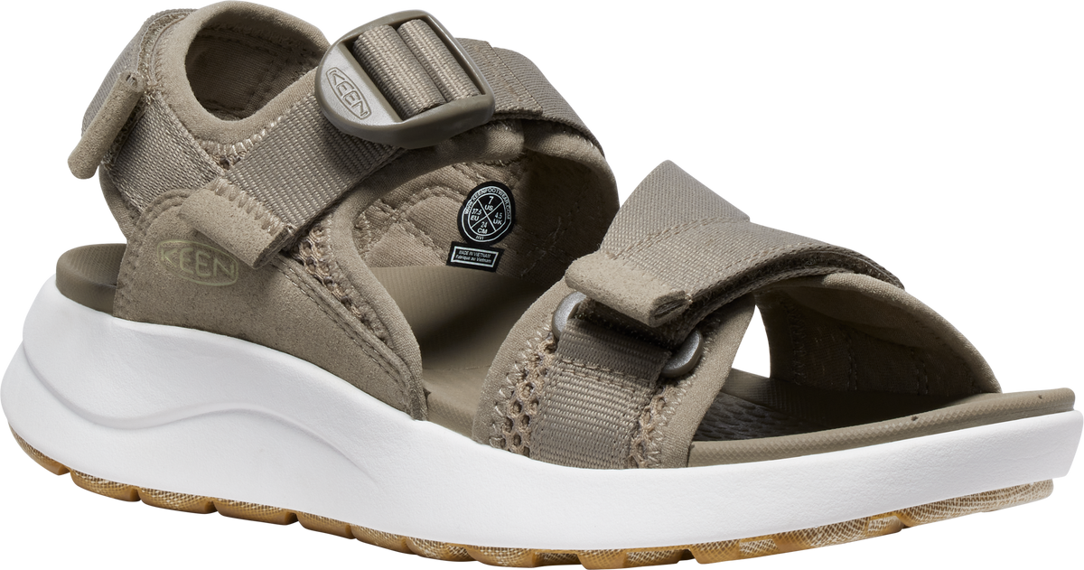 A khaki-colored sandal with hook-and-loop straps and a white, cushioned sole.